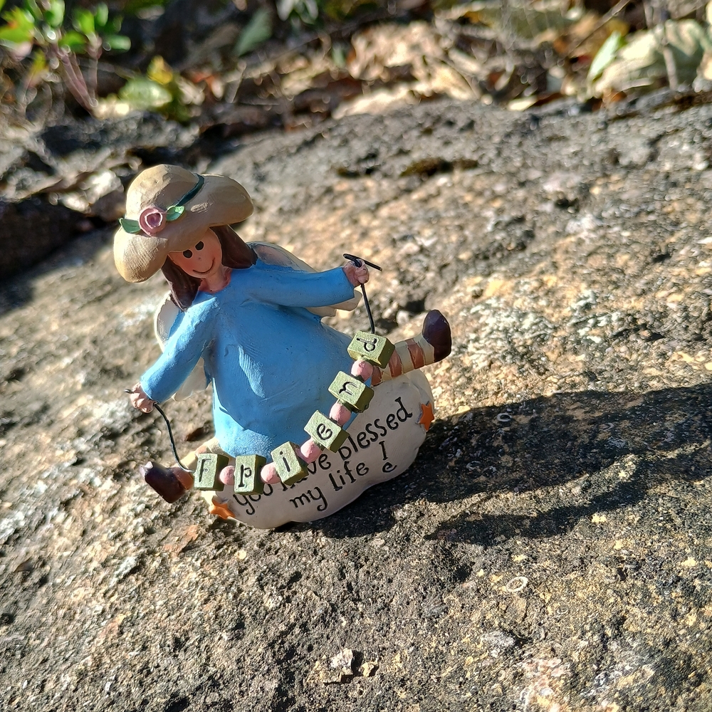 2008 Blossom Bucket girl with "Friends" banner by Suzi Skoglund, resin sculpture
